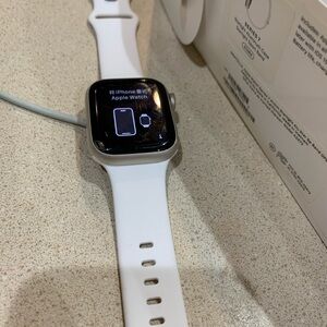 Apple Silver Smartwatch with White Band and Square Display